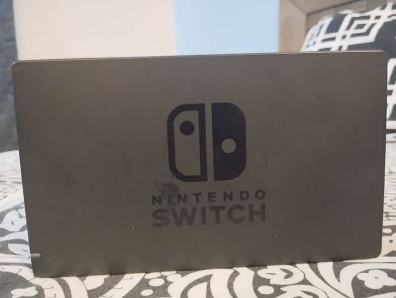 nintendo switch with cover case and games 6