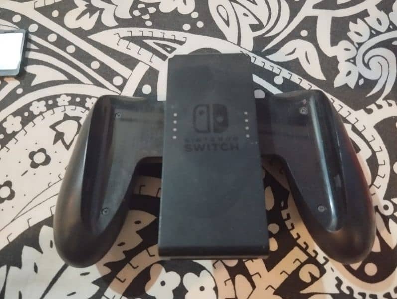 nintendo switch with cover case and games 7