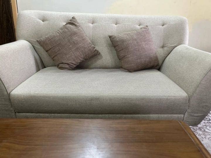 Brand new 7 seater  sofas with two side tools and table . 1