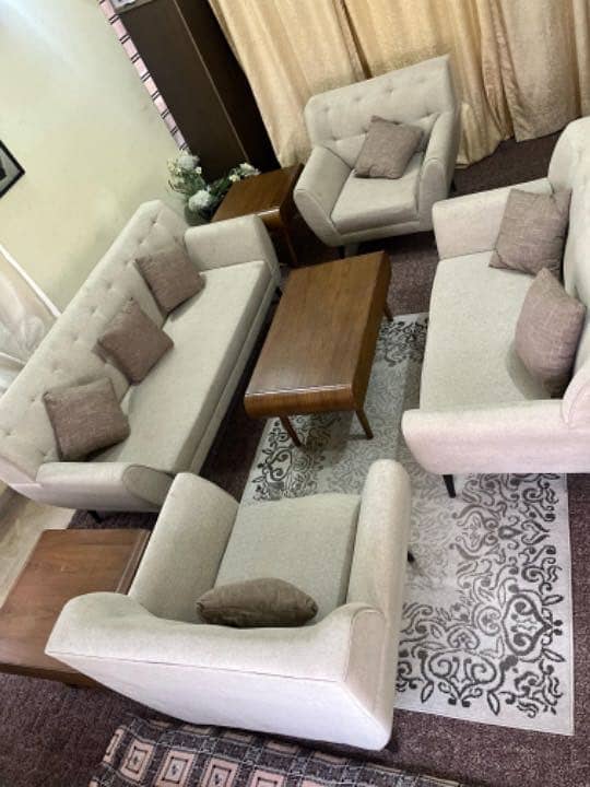 Brand new 7 seater  sofas with two side tools and table . 2