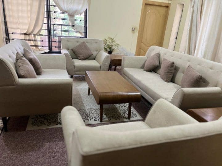 Brand new 7 seater  sofas with two side tools and table . 4