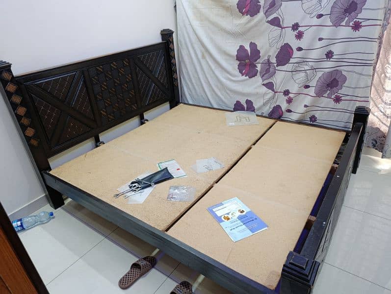 neat and clean bed with side table 2