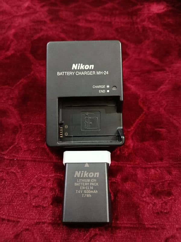 Nikon D5200 with 18-55mm lens + SB 400 Speedlight flash + 16 gb Card 5