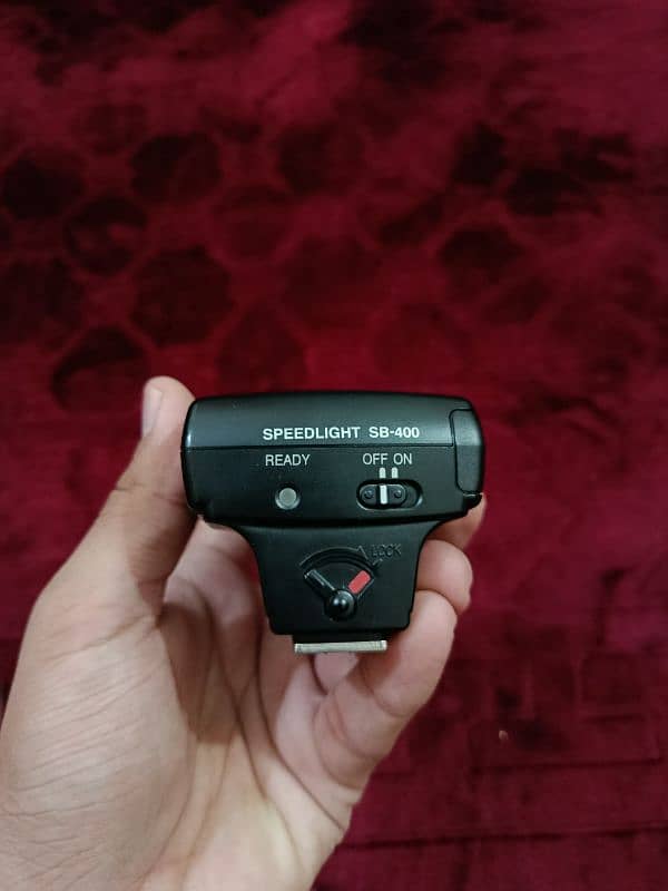 Nikon D5200 with 18-55mm lens + SB 400 Speedlight flash + 16 gb Card 9