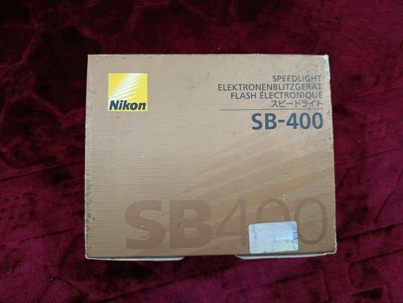 Nikon D5200 with 18-55mm lens + SB 400 Speedlight flash + 16 gb Card 11