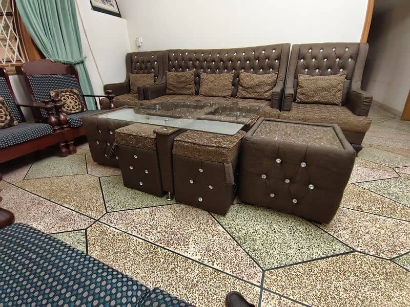 5 seater sofa set and center table with four sitting stools 0
