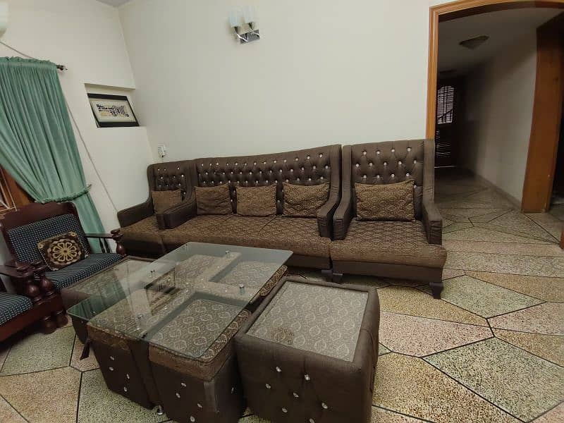 5 seater sofa set and center table with four sitting stools 1