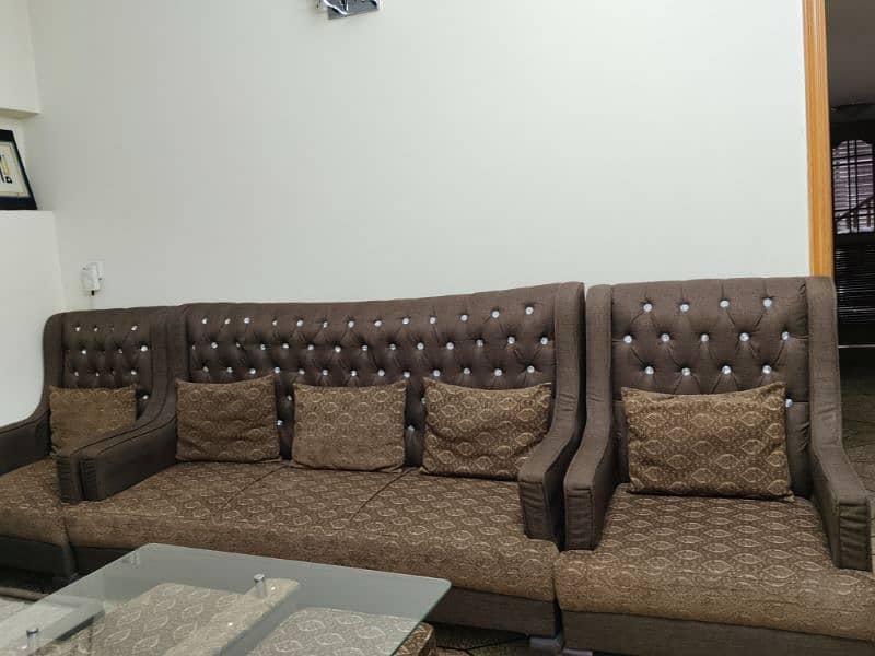 5 seater sofa set and center table with four sitting stools 5