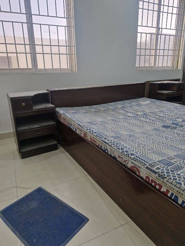 double bed with drawer in base and 2 side tables 0