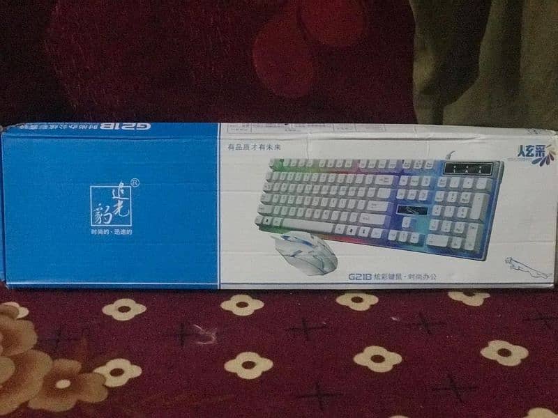 white gaming keyboard with mouse with rg 7