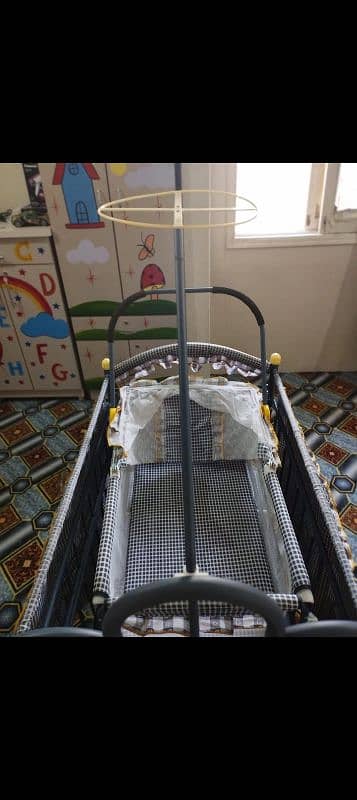 Kids caddler swing and wheeler cot. 3 in 1 3