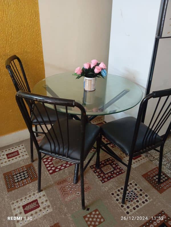 glass circle dinning table with 4 chairs 0