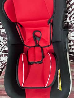 red and black baby car seat