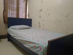 wooden single bed