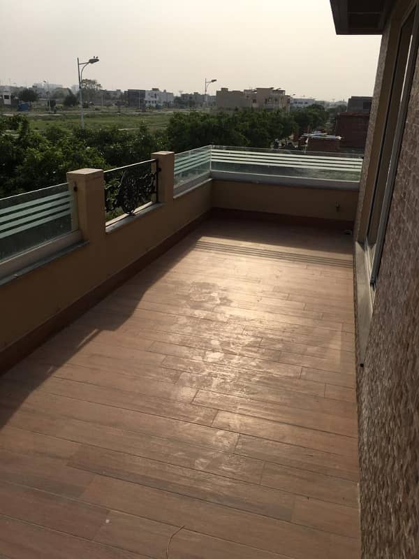Hot Location, Cool Price 1-Kanal Modern Portion with 3 Luxurious Bedrooms, Front & Back Terraces, and Private Entry in DHA Phase 7 4