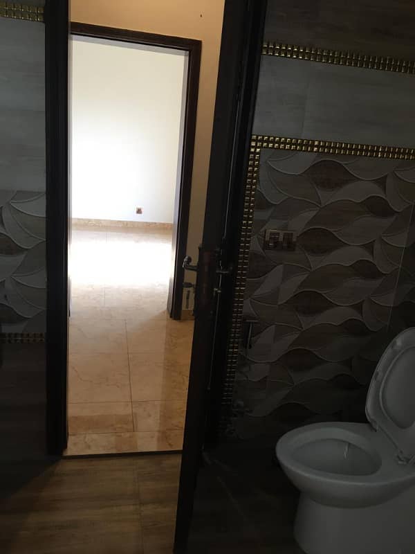 Hot Location, Cool Price 1-Kanal Modern Portion with 3 Luxurious Bedrooms, Front & Back Terraces, and Private Entry in DHA Phase 7 17