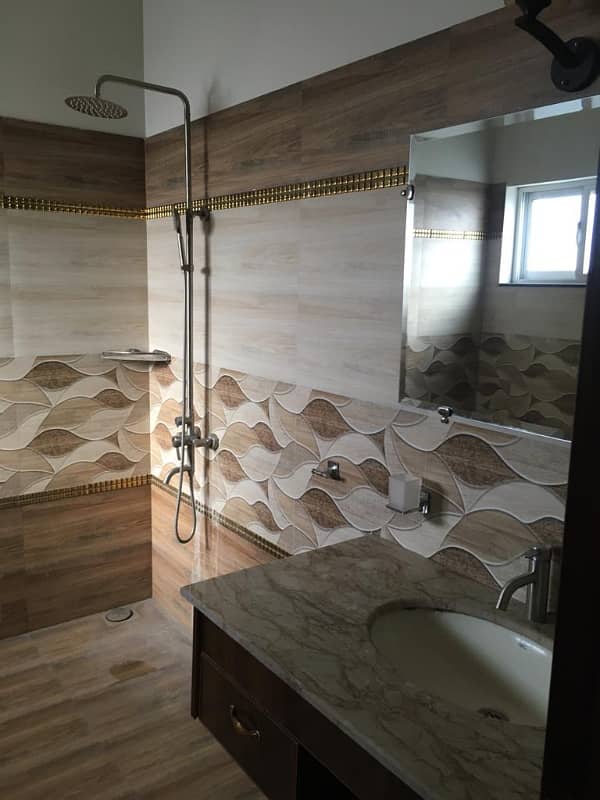 Hot Location, Cool Price 1-Kanal Modern Portion with 3 Luxurious Bedrooms, Front & Back Terraces, and Private Entry in DHA Phase 7 18