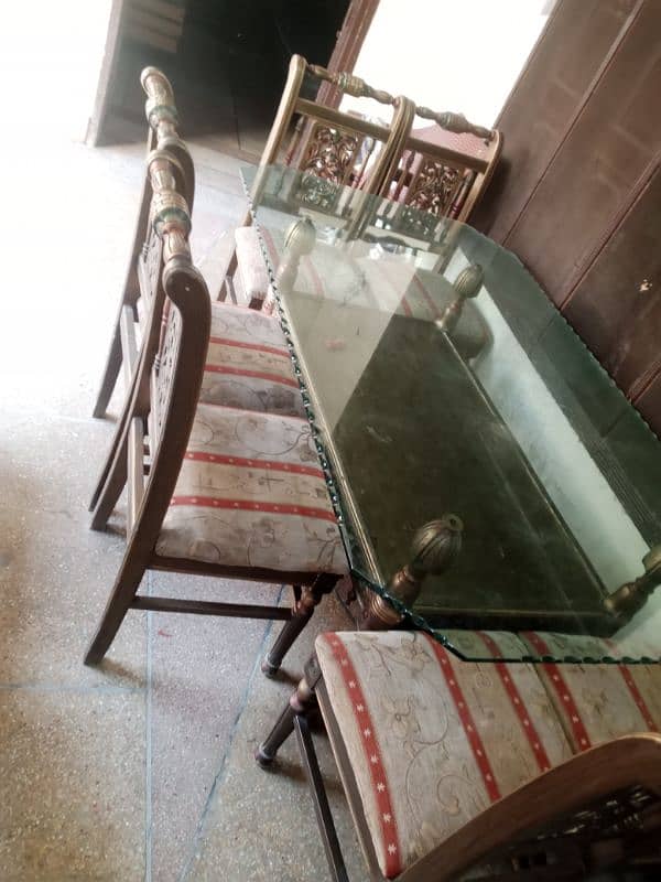 6 seater/chair dinning table with solid glass top 1