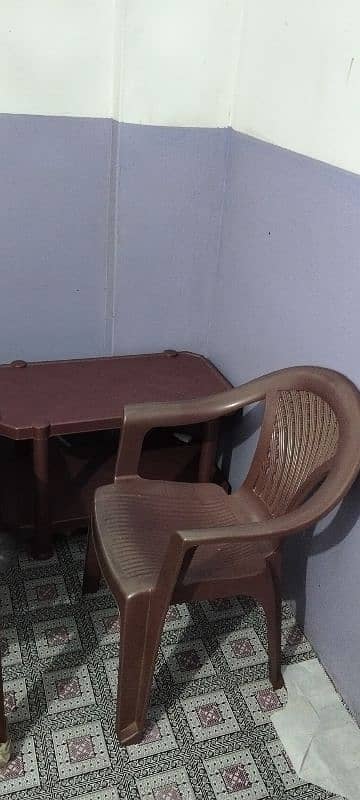 1 plastic chair and 1 table 0
