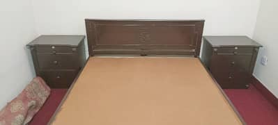 Queen size bed used with 2 side tables