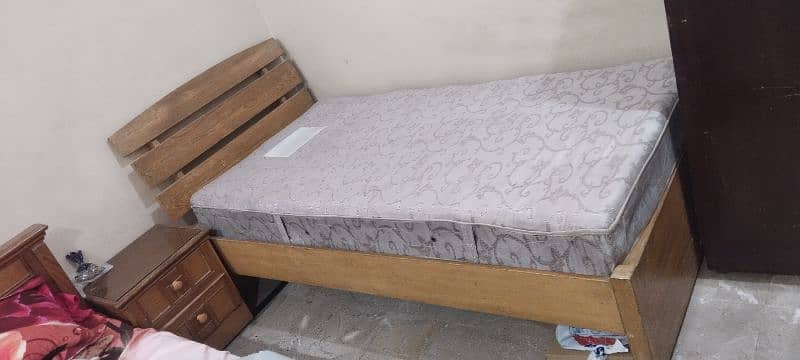 bed with mattress and two side tables 0
