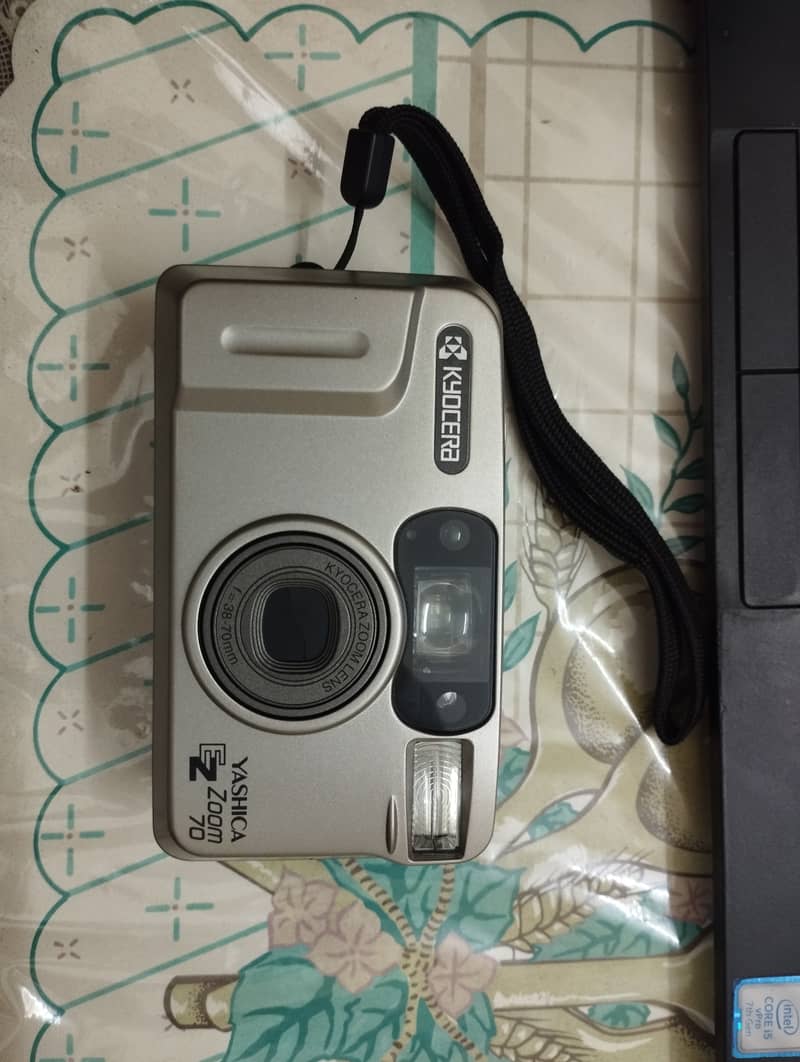 The Yashica EZS Zoom 70 is a fully automatic 35mm point-and-shoot film 0