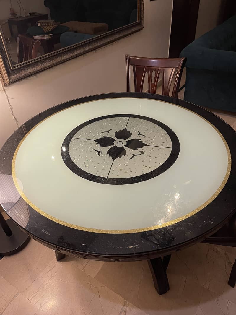 Glass dining table with wooden structure with four chairs 7