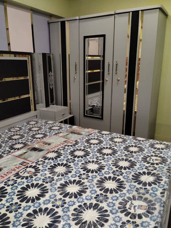 bed with side tables,dressing table, 3 door cupboards, 3 door divider 1