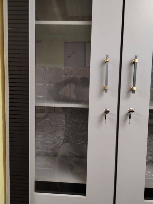 bed with side tables,dressing table, 3 door cupboards, 3 door divider 5