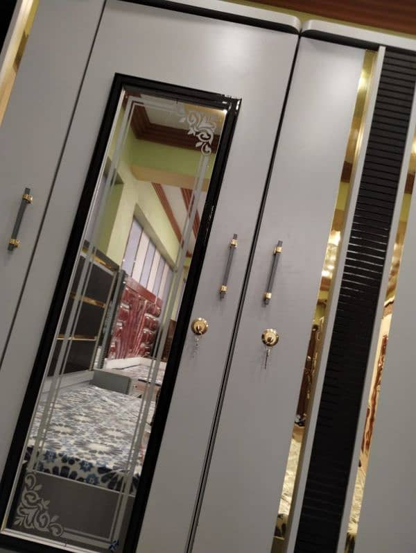 bed with side tables,dressing table, 3 door cupboards, 3 door divider 7
