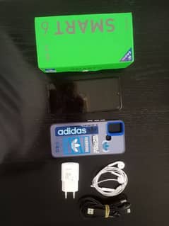 Infinix Smart 6 with extra hands-free and case