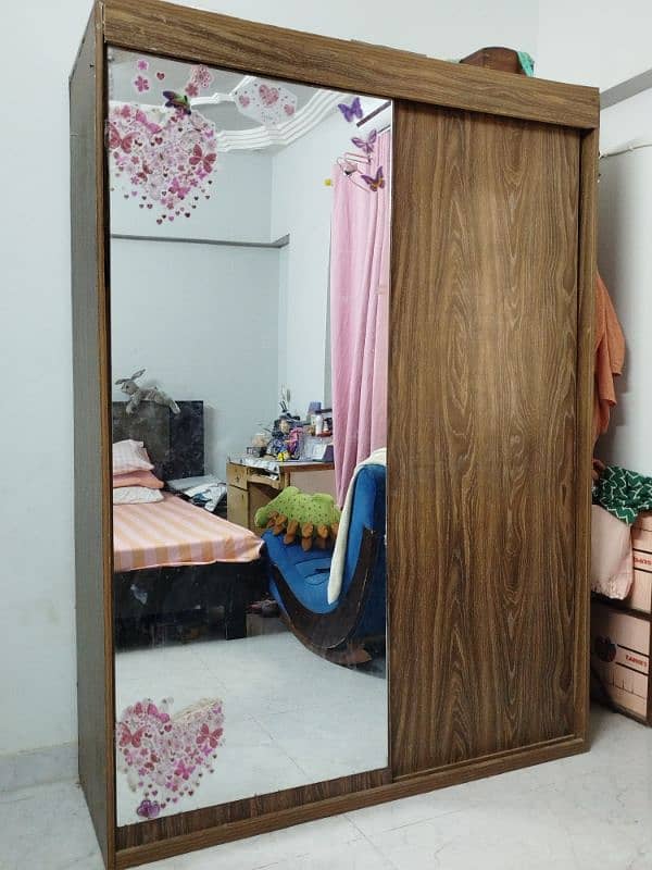 Sliding door wardrobe with a mirror attached. 0