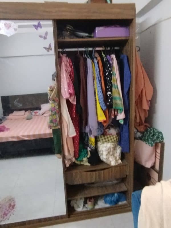 Sliding door wardrobe with a mirror attached. 1