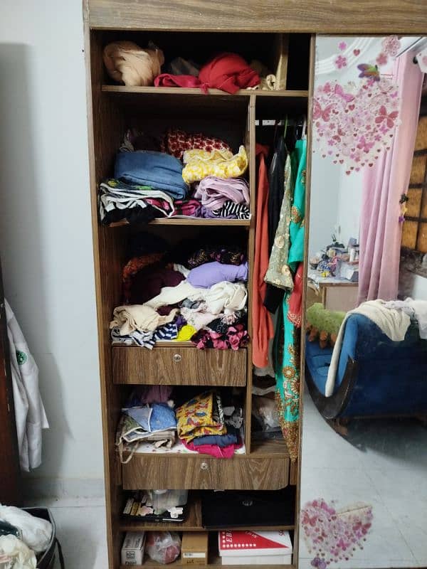 Sliding door wardrobe with a mirror attached. 2