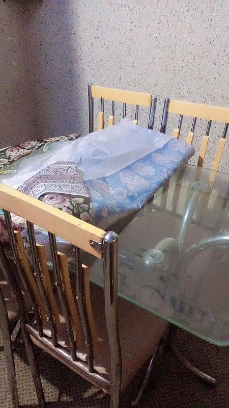 Glass table with six chairs in good condition 2