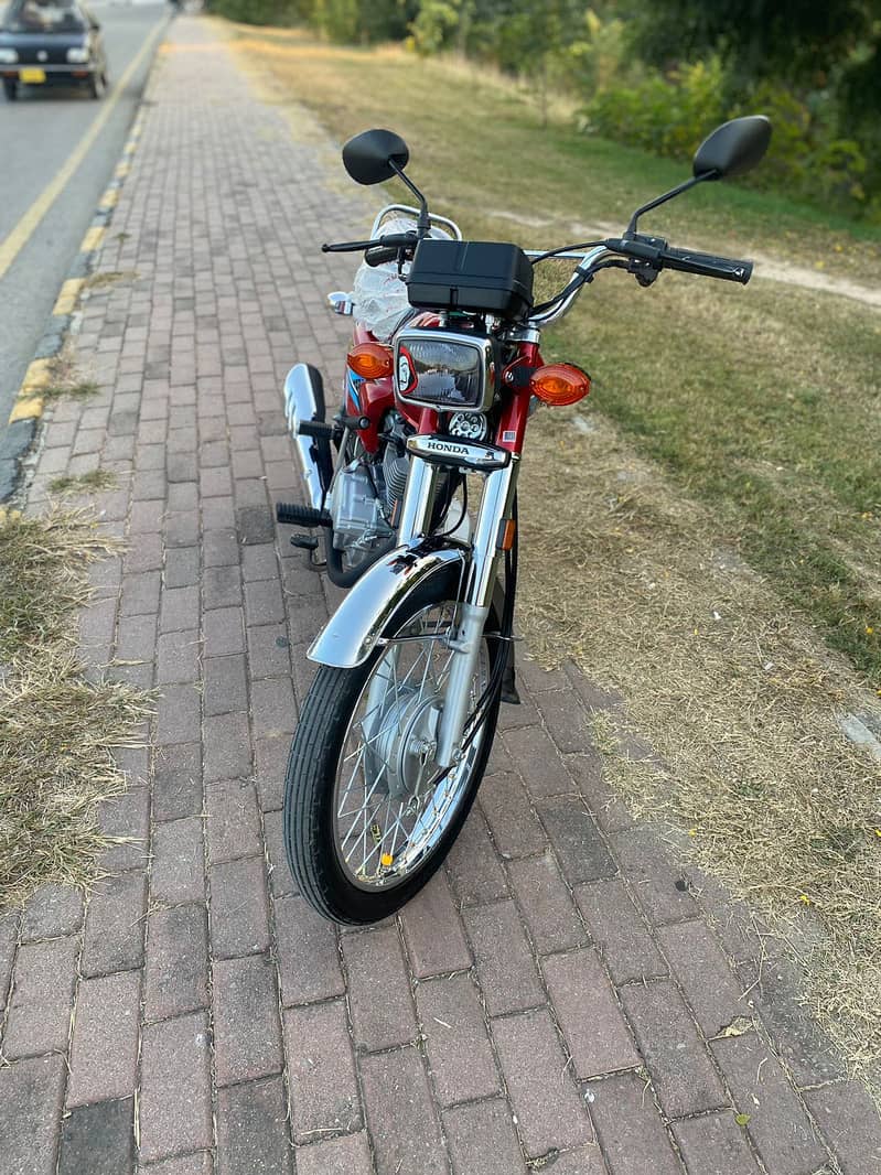 Honda 125 2024 model lush condition islamabad no  redcolour 6