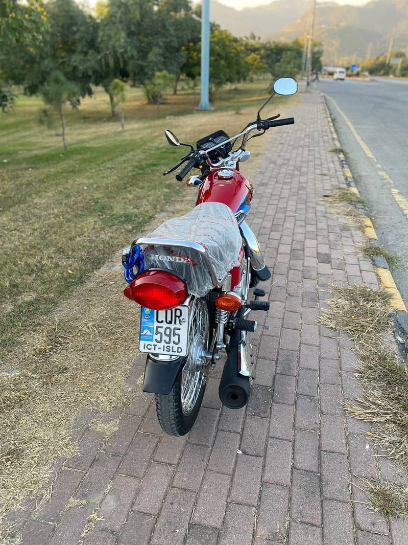 Honda 125 2024 model lush condition islamabad no  redcolour 8