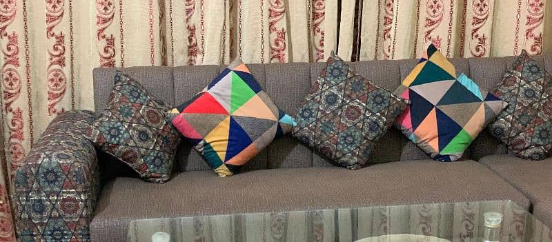 7 seater L shaped complete sofa set, 1 glass table, 4 puffy set. 3