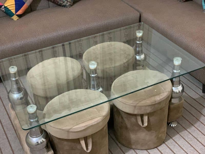 7 seater L shaped complete sofa set, 1 glass table, 4 puffy set. 4
