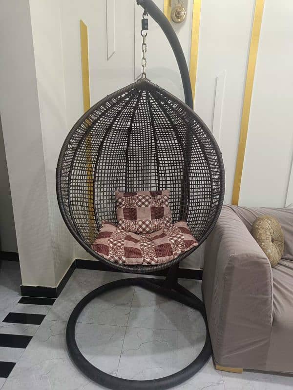 Swing chair with iron stand and cousins. 1