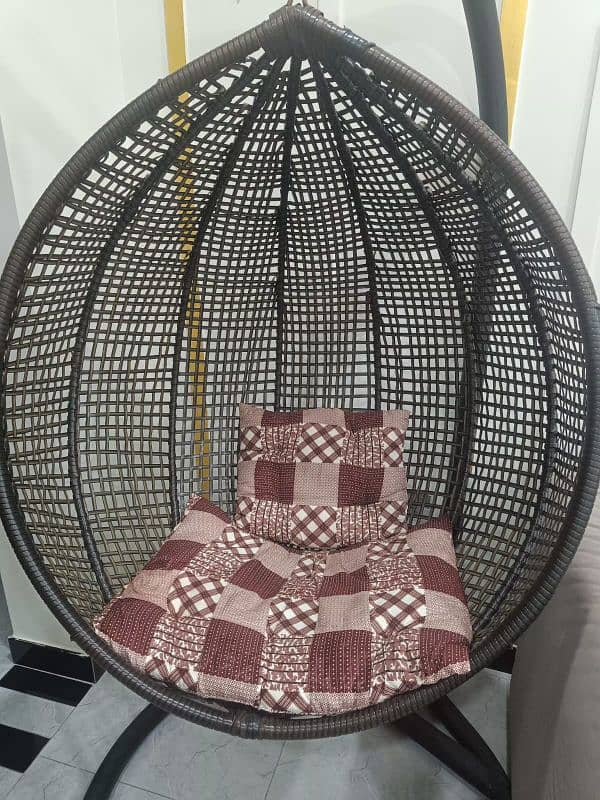 Swing chair with iron stand and cousins. 2