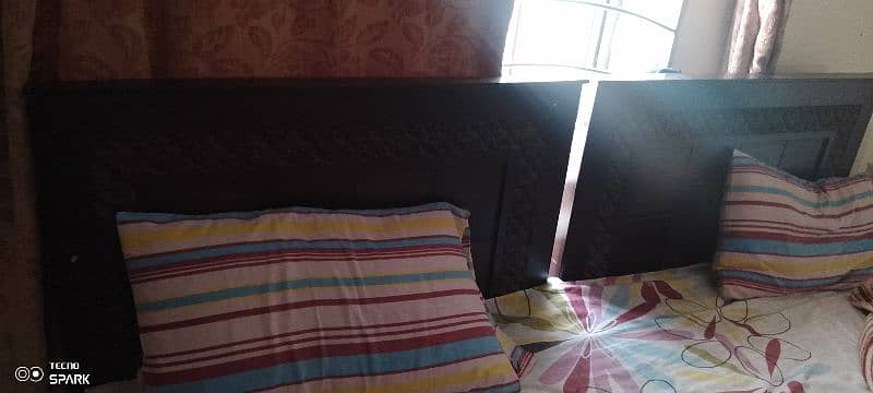 Two single beds with mattress 0