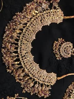 maroon and gold color bridal jewellery