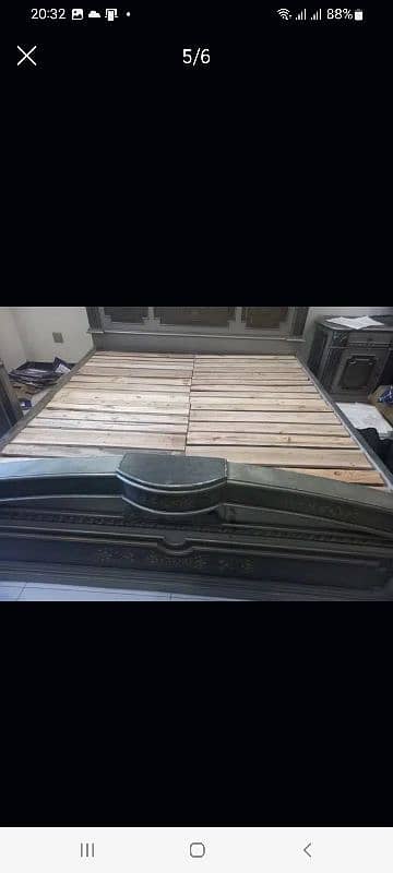 wooden bed with dressing 0