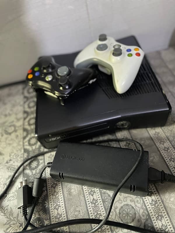 Xbox 360 Slim Jtag with 77 games installed. Like a new. 12