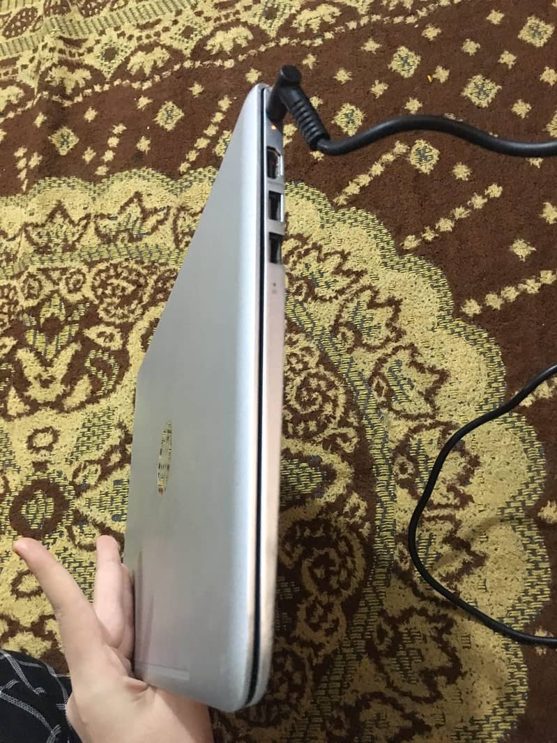 The laptop in the image is an HP Envy series model 1