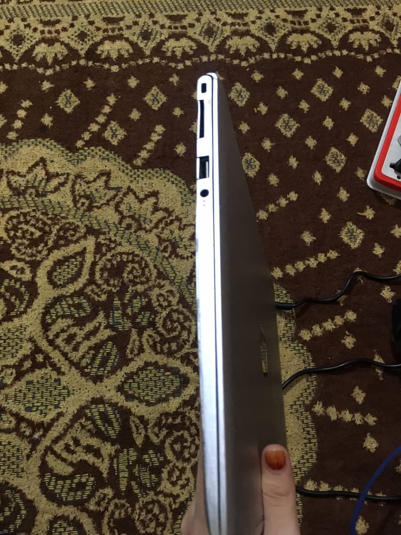 The laptop in the image is an HP Envy series model 2
