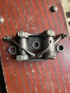Honda 125 Genuine Rocker Plate