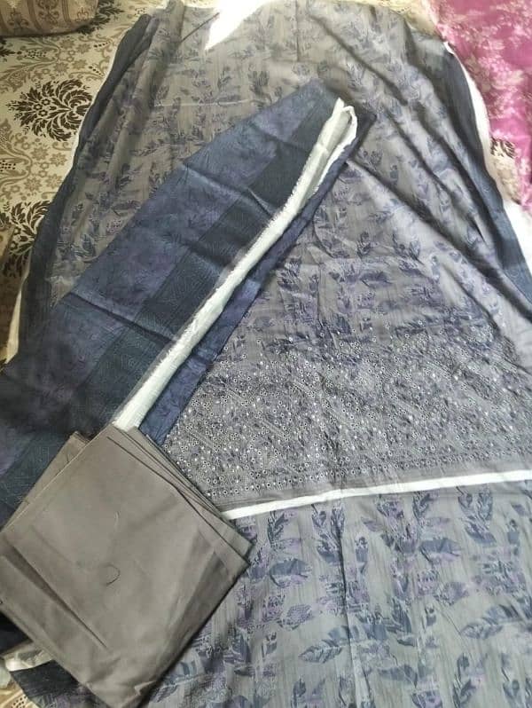 J. new branded unstiched 3 piece suit zehri 0