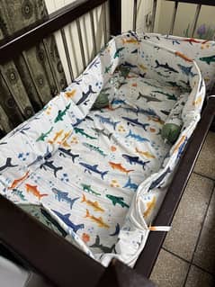 Wooden baby cot.